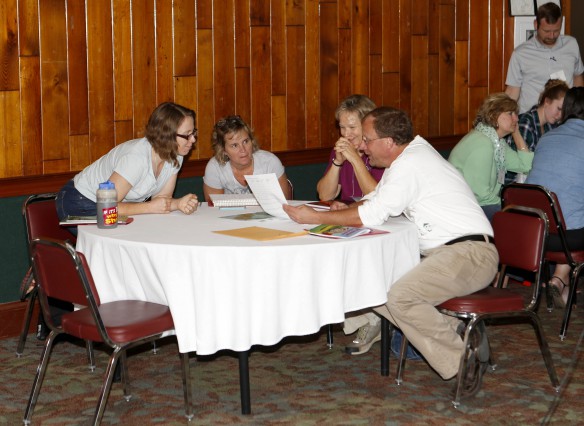 Amanda Heltzel, second from right, a science lab teacher at Julius Marks Elementary School (Fayette County), participates in an exercise with Sarah Talley of the USDA Forest Service, Barb Cornett of the Life Adventure Center/Buckley Wildlife Sanctuary and David Lawler of Maysville Community and Technical College during a discussion on flipped classrooms at the Kentucky Association for Environmental Education Conference at Jenny Wiley State Resort Park. Photo by Mike Marsee, Sept. 11, 2015