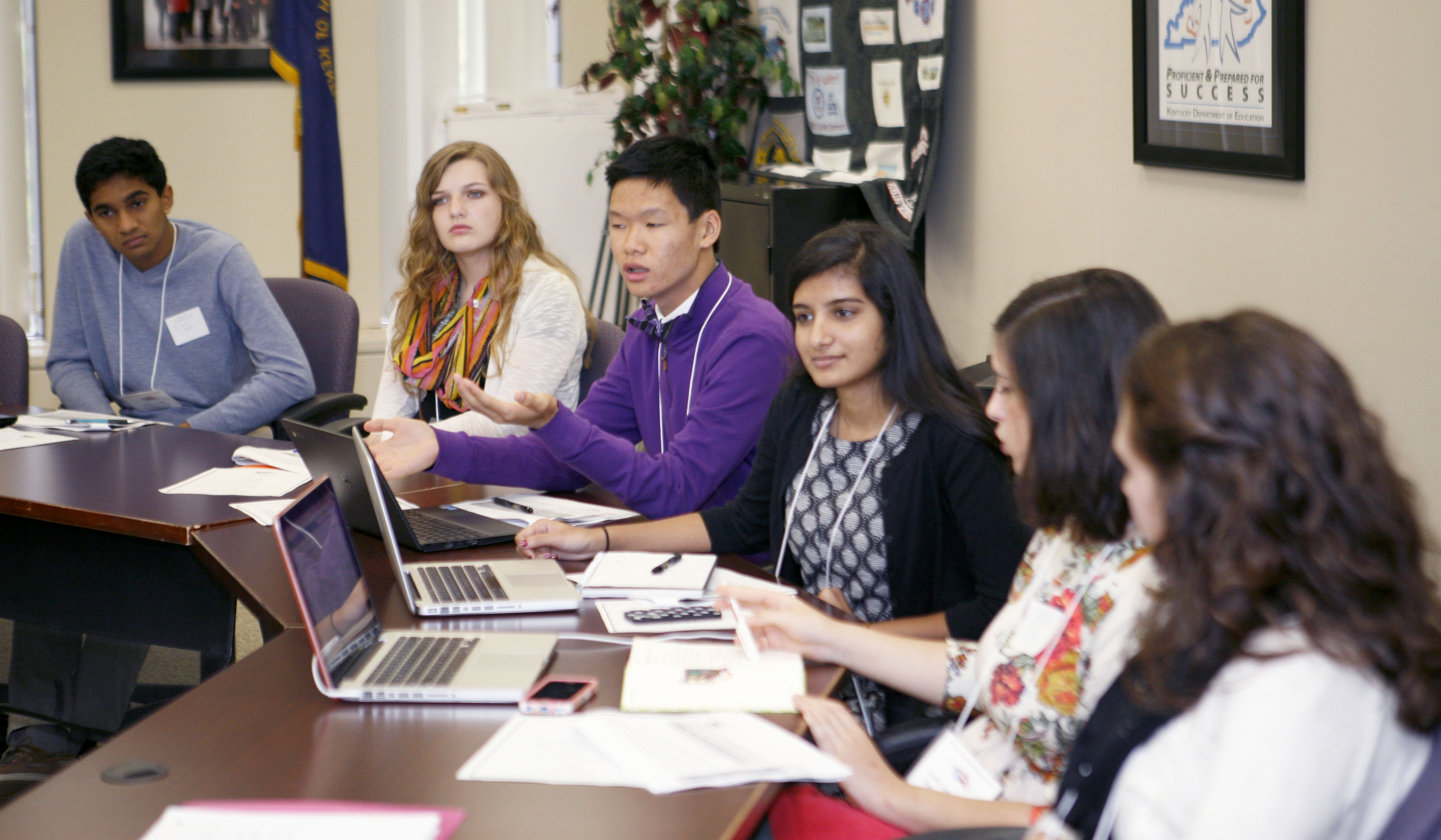 Wesley Wei, center, a junior at Boyle County High School, speaks as fellow members of the Next-Generation Student Advisory Council listen during the council’s first meeting of the 2015-16 school year at the Capital Plaza Tower in Frankfort. Also pictured are Amrit Avula of Bowling Green High School (Bowling Green Independent), Kaeli Riggs of Seneca High School (Jefferson County), Roop Patel of Beechwood High School (Beechwood Independent), Emily Salamanca of Henry Clay High School (Fayette County) and Kenzy Moore of Russell High School (Russell Independent). Photo by Mike Marsee, Nov. 5, 2015