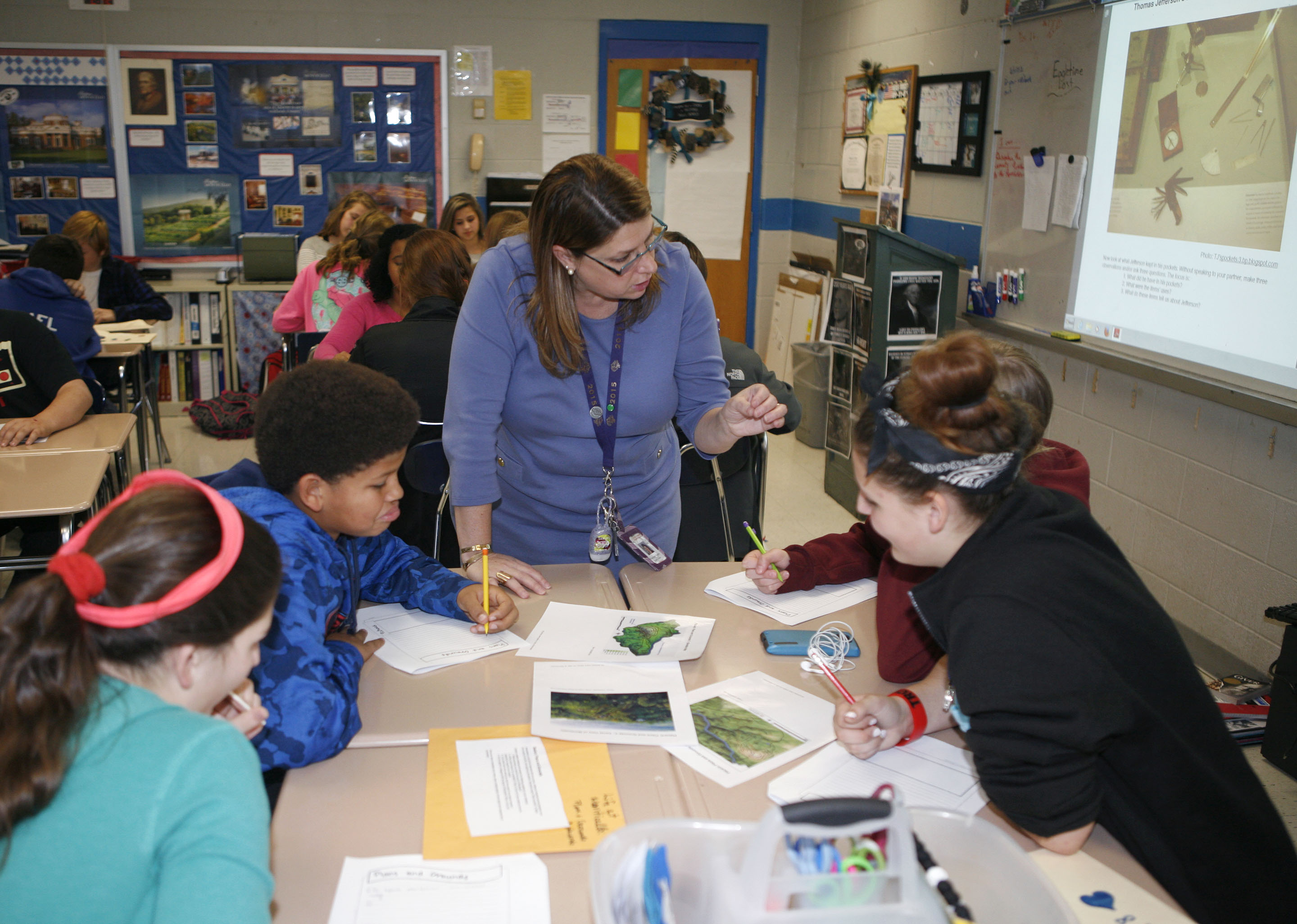 Lincoln County Middle School teacher Rachael Yaden gives instructions to students Faith Godby, Bryston Alcorn, Faith Brock and Raelyn Barnes, left to right, during an inquiry lesson on life at Monticello, Thomas Jefferson’s home, in her 8th-grade social studies class. Photo by Mike Marsee, Nov. 16, 2015