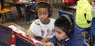 Third-graders Tyrese Myrick and Omar Hernandez-Resa code on laptops during Hour of Code at Beechwood Elementary last school year. Dec. 7, 2015 Brenna Kelly