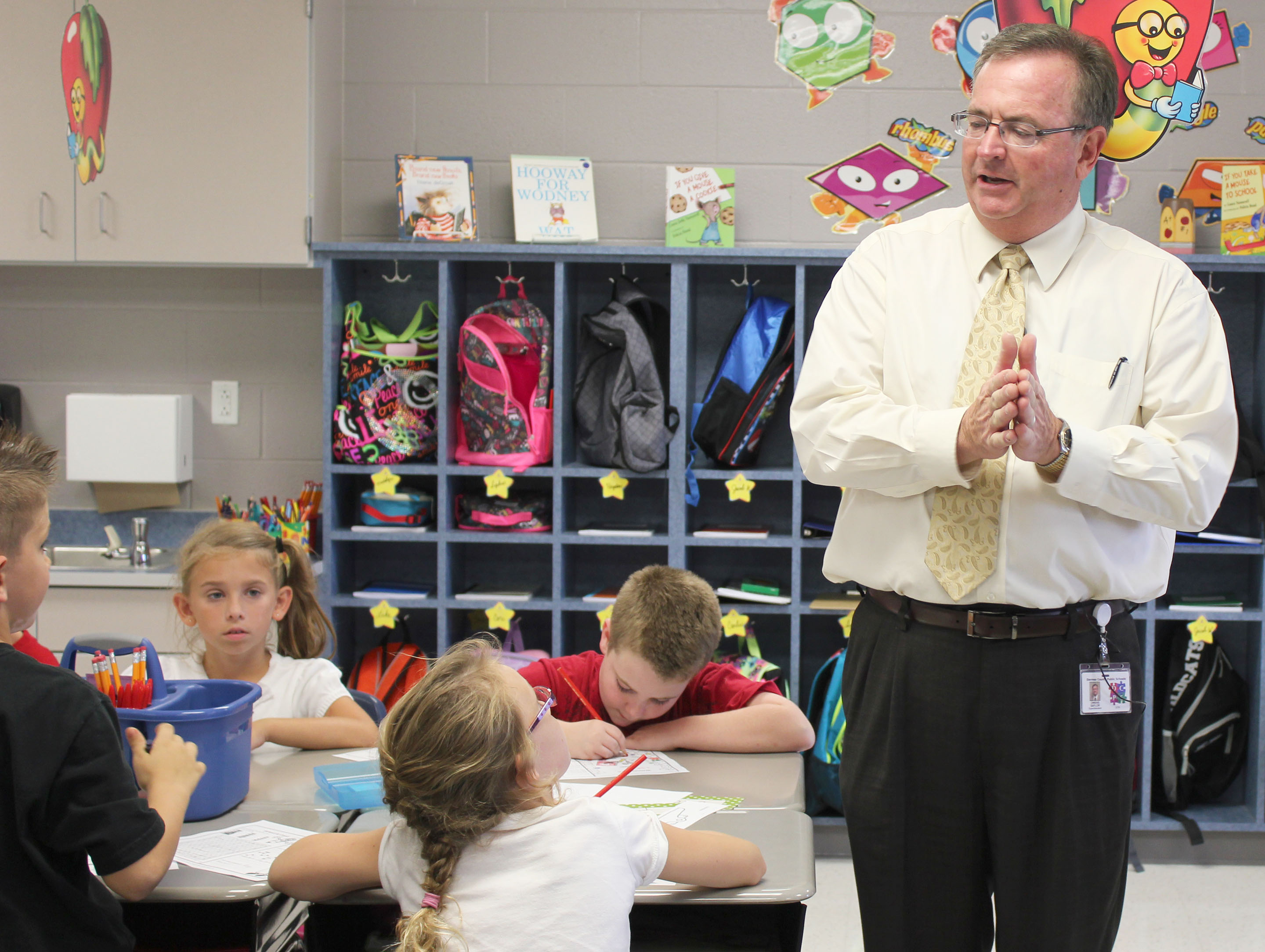 Owens Saylor, superintendent of the Daviess County school district, visits an elementary school classroom in his district. Saylor, who was named the 2016 Superintendent of the Year by the Kentucky Association of School Administrators, has led a program that introduces students to college campuses while they are still in elementary school. Photo by Lora Wimsatt