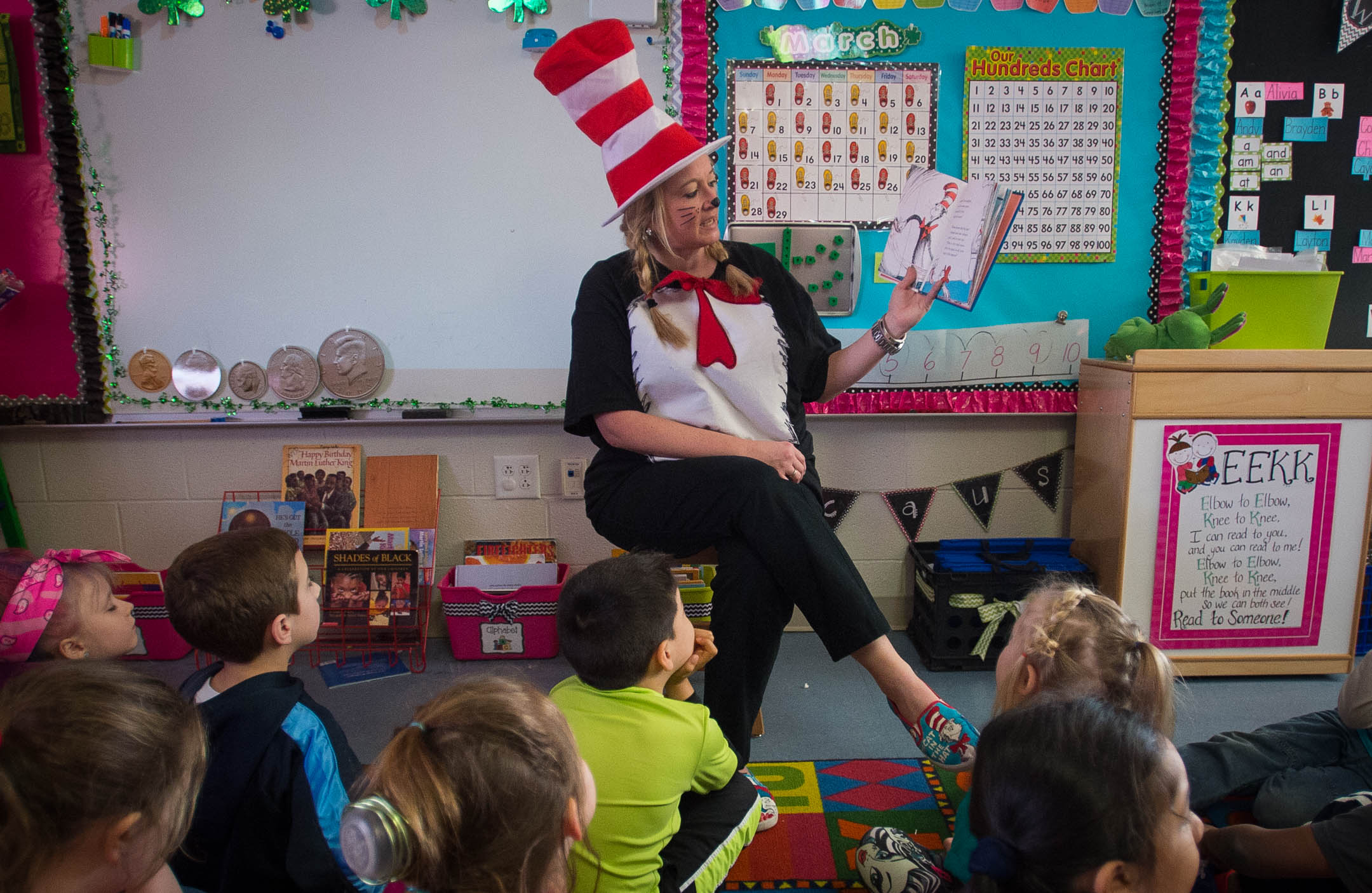 Katrina Cyrus reads "The Cat in the Hat Comes Back" to her kindergarten class in honor of Dr. Seuss' birthday and Read Across America week. Cyrus and other teachers dressed as the famous character and students took part in a crazy-hair day.