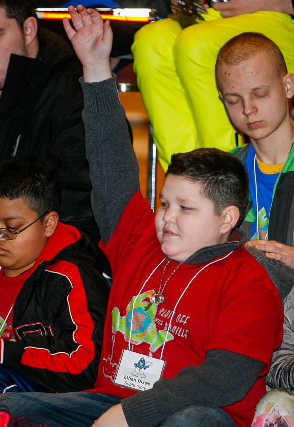 Ethan Dixon raises his hand as he is introduced during the opening ceremony for the Kentucky Regional Braille Challenge. Photo by Mike Marsee, Feb. 18, 2016