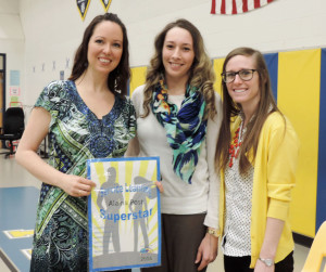 Boone County Spanish teacher Alaina Post, from left, Boone County Service Learning Coordinator Paige Holmes and preschool teacher Jessica Courter celebrate Post's being recognized by Children, Inc., for a service-learning project. Post's students taught Spanish to the children at the preschool where Courter teachers. Photo by Stephanie Hagerty 