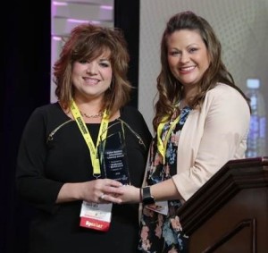 Karen West, left, executive director of Redhound Enrichment, accepts the Dollar General Afterschool Literacy Award from Lindsey Sublett, community initiatives administrator with Dollar General Corporation at the National AfterSchool Association’s annual convention in Orlando, Fla. Photo submitted, March 20, 2016