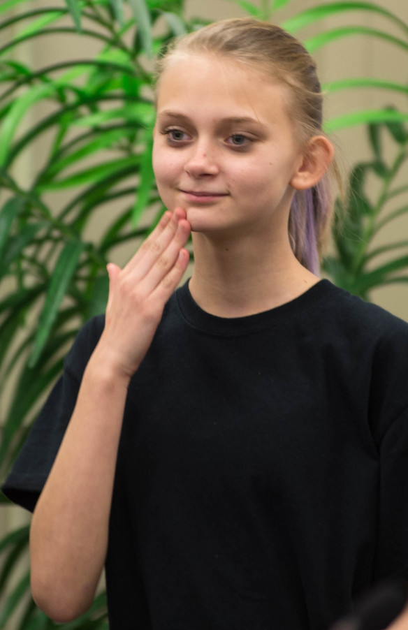 A member of the Kentucky School for the Deaf Signing Choir perform during the Kentucky Board of Education meeting. Photo by Bobby Ellis, April 13, 2016