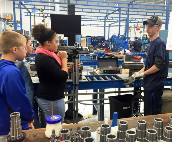 Mason County Middle School students, from left, Nick Thomas, Sydney Lilley and Jayla Sergent interview a Stober employee during the creation of a video for a regional video contest entitled, “What’s Cool about Manufacturing?” Photo submitted by Brian McDowell