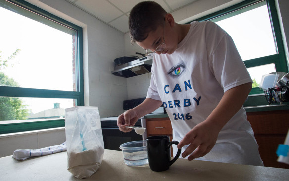 Brandon Marini, a 4th grader at Rineyville Elementary, mixes ingredients at the Eye Can Derby. Photo by Bobby Ellis, April 29, 2016