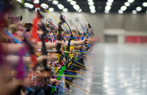 Competitors at the NASP National Tournament in Louisville notch their arrows.