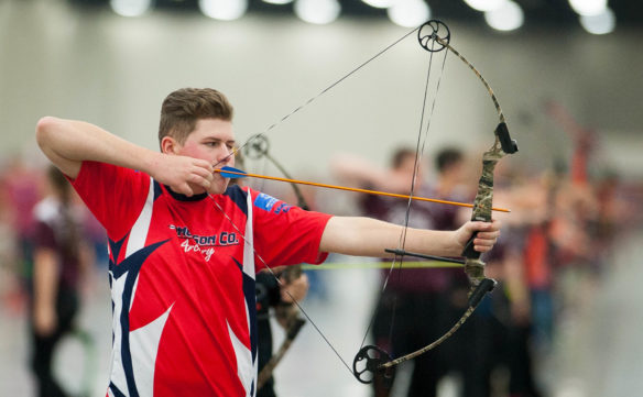 Beau Kelley, a junior at Edmonson County High School, aims at a target before releasing his arrow at the NASP National Tournament in Louisville.