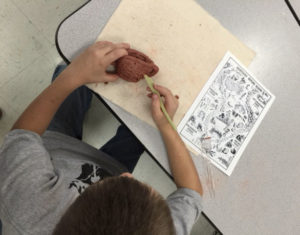 A student at Bridgeport Elementary School (Franklin County) creates a clay pinch-pot in the style of Native Americans. Photo by Megan Sauter 