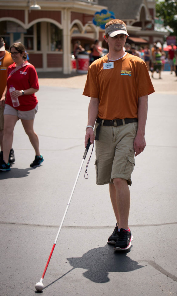 Jacob Hack walks to lunch during his break at Kentucky Kingdom. Photo by Bobby Ellis, June 24, 2016
