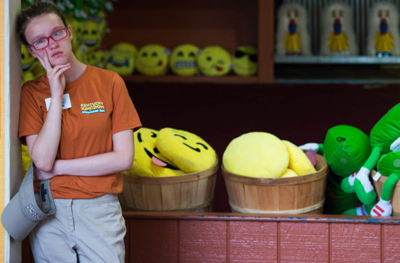 Destiny Gregory waits at her station after returning from her lunch break at Kentucky Kingdom. Photo by Bobby Ellis, June 24, 2016