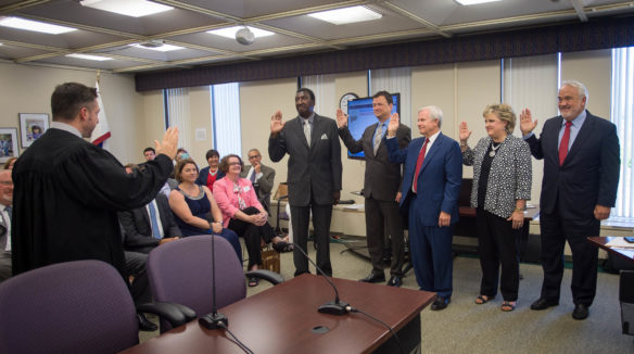 Five new members of the Kentucky Board of Education are sworn in before the start of the board's meeting on June 8, 2016. The new members are, from left, Milton C. Seymore of Louisville, Gary W. Houchens of Bowling Green, Rich Gimmel of Louisville, Alesa G. Johnson of Somerset and Ben Cundiff of Cadiz. Photo by Bobby Ellis, June 8, 2016
