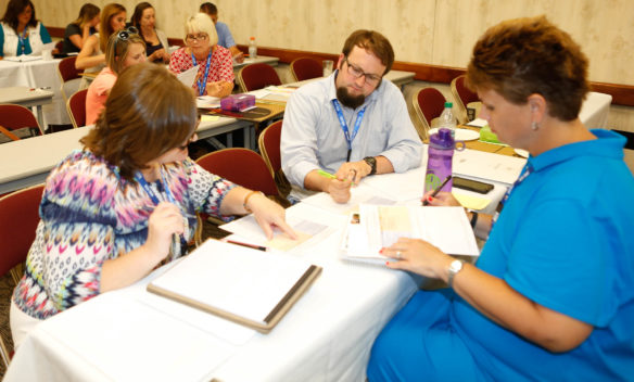 Diane Poindexter, science teacher at Cumberland County High School; Jonathan Brison, 4th-grade science teacher at Hopkins Elementary School (Somerset Independent); and Angela Richards, kindergarten teacher at Hanson Elementary (Hopkins County) build learning targets for elementary science experiments at the Let's TALK conference.  Photo by Brenna R. Kelly, June 13, 2016
