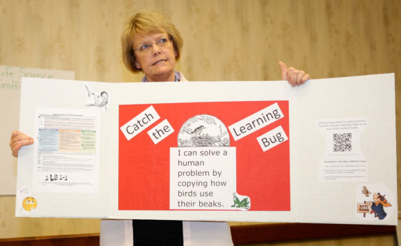 Vivian Bowles, a 4th-grade teacher at Kit Carson Elementary (Madison County), explains one of the pencil box science experiments at the Let's TALK conference in Covington. The Kentucky Education Association developed the experiments to help elementary teachers implement the Kentucky Academic Standards for Science.  Photo by Brenna R. Kelly, June 13, 2016