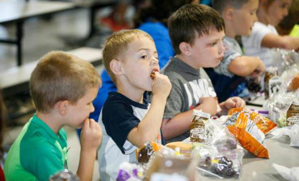 Children enjoy their lunch during a kickoff event for the Summer Food Service Program at Calvary Elementary School (Marion County). The program will provide more than 2 million breakfasts, lunches and snacks this summer to more than 20,000 Kentucky children who might not otherwise have access to nutritious meals when school is not in session. Photo by Mike Marsee, June 14, 2016
