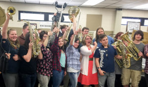 Members of the band at Johnson Central High School display their new instruments as director Martina Lutz, front row, center, points to country music star Chris Stapleton, a graduate of the school who headed a donation of $57,000 worth of instruments to his alma mater. The gift provided 28 new instruments and a line of drum carriers. Photo submitted, March 24, 2016