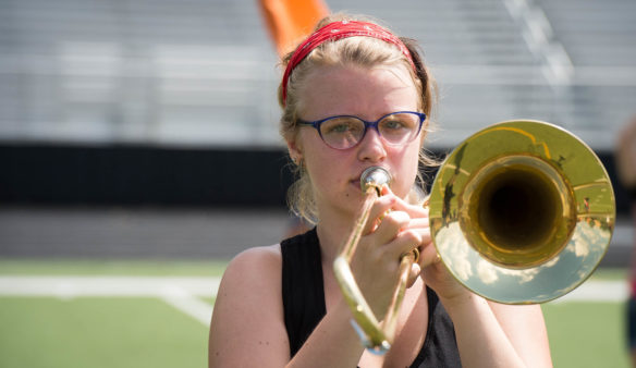 Alexandra Picklesimer stands with her trombone at attention. Bobby Ellis, July 19, 2016