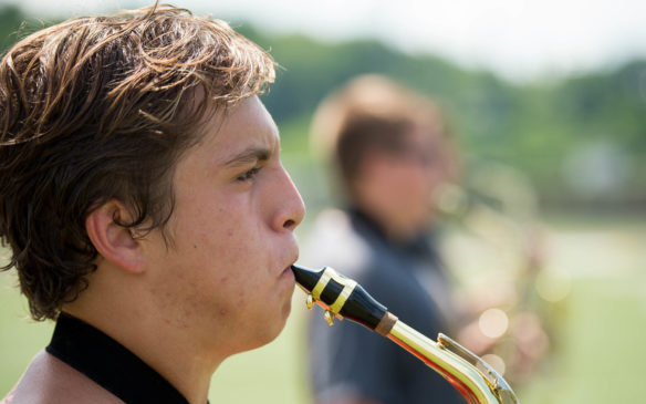Johnson Central student Tray Kistner plays his saxophone during band camp. Photo by Bobby Ellis, July 19, 2016