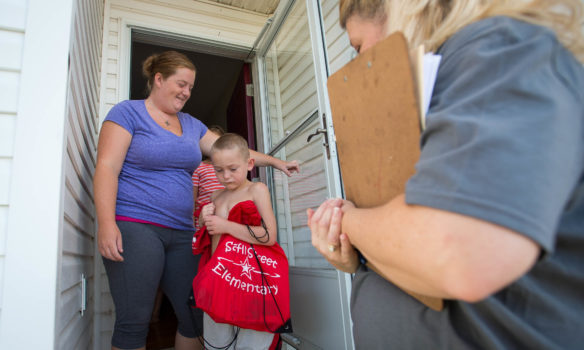 Ann Florer and her son, Landon Florer, greet Saffell Street Elementary School 2nd-grade teacher Elizabeth Harley during the Anderson County school’s first Home Visit Blitz just before the start of the school year. Teachers visited the homes of students as a way to engage the community and get children excited about going back to class. Photo by Bobby Ellis, Aug. 8, 2016