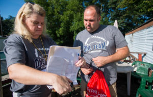 Elizabeth Harley, a 2nd-grade teacher at Saffell Street Elementary School (Anderson County), and Todd Wooldridge, the school’s principal, look over the list of students they visited during the Home Visit Blitz. Teachers dropped off drawstring backpacks for students and information for parents during the visits. Photo by Bobby Ellis, Aug. 8, 2016