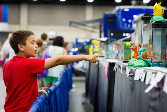 Johnny Brushaber, of Jefferson County, points out Pokemon figurines used to decorate a fish tank on exhibit at the State Fair. Photo by Bobby Ellis, Aug. 18, 2016