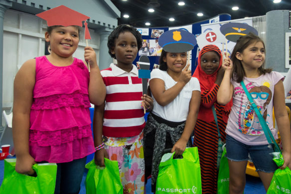 Students from King Elementary (Jefferson County) pose with props at the Kentucky Department of Education booth at the Kentucky State Fair. Photo by Bobby Ellis, Aug. 25, 2016