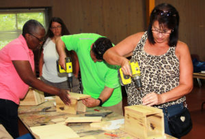 The Kentucky Department of Education's Veda McClain, from left, Eric Reimer, an elementary school teacher from Barren County; and Becky Whelan, an elementary school teacher from Meade County, make bluebird boxes at last year's Teacher Renewal Summer Institute. Photo courtesy of Deb Spillman 