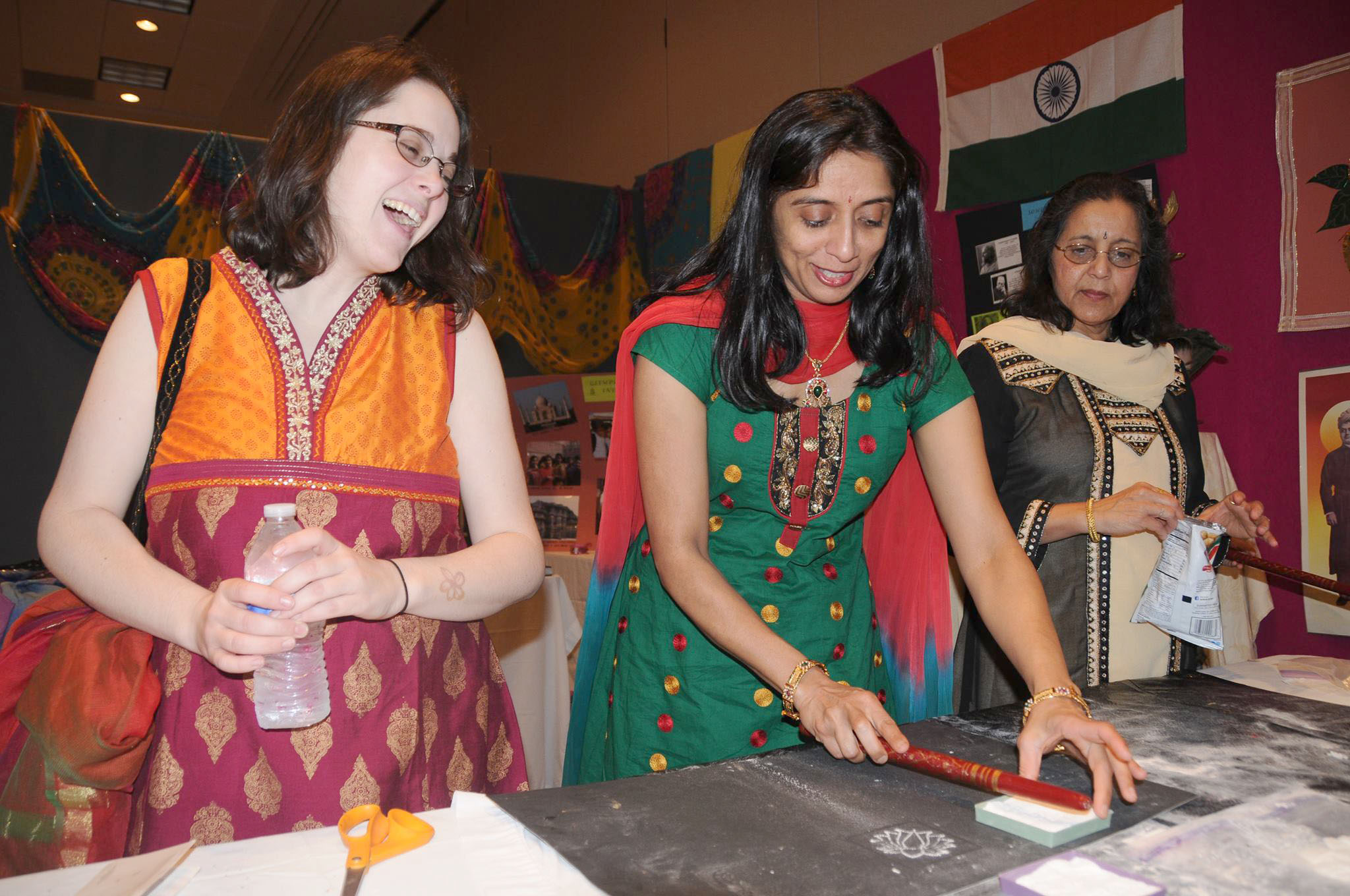 Nina Shalom, center, a member of the International Festival committee, works with volunteers at the booth that represents India at the Global Village at the Hopkinsville. The festival, which began in 2009, celebrates the county's rich cultural diversity. Photo submitted by the City of Hopkinsville