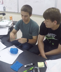 Two of Carly Baldwin's students demonstrate how to crochet as part of Genius Hour. Baldwin, who teaches chemistry at Boyd County High School, uses class time each Friday to let students explore any idea as long as it can be researched and demonstrated by a creative product. Submitted photo by Carly Baldwin