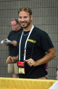 Nathan Hager, a carpentry instructor at Meade County Area Technology Center, speaks with a student before a competition at the SkillsUSA Championships. Hager participated in SkillsUSA as a student at Meade County High School, and now he helps advise students in one of the largest chapters in Kentucky. Photo By Bobby Ellis, June 22, 2016