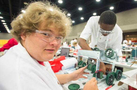 Shane Caldwell, left, and McKenxey Boateng, students at Southside Technical Center (Fayette County), work on their robot during the mobile robotic technology competition at the 2016 SkillsUSA Championships in Louisville. Students from every state and three U.S. territories took part in more than 100 skills and leadership competitions. Photo by Bobby Ellis, June 22, 2016