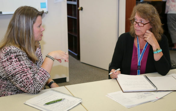 Cherry Boyles, left, Washington County’s director of instruction and Rae McEntyre, Kentucky Department of Education science consultant, work on a plan to train Washington County teachers on enhancing their use of formative assessment. Photo by Brenna R. Kelly, Sept. 6, 2016