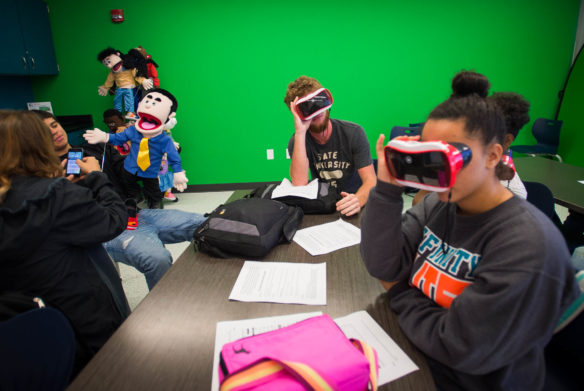 Students at Eminence High School use virutual reality goggles and puppets during a class in the schools new Ed Hub. Photo by Bobby Ellis, Sept. 15, 2016