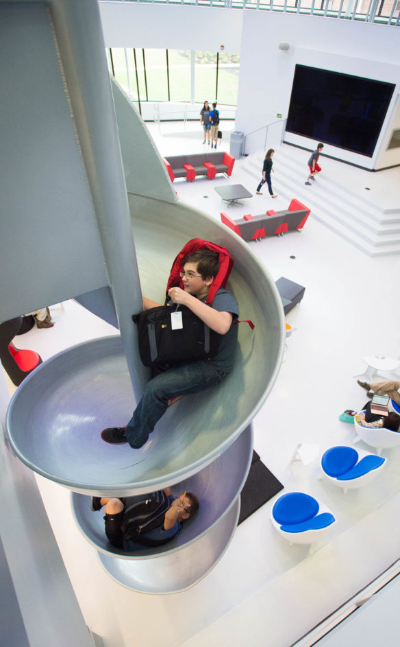 Students at Eminence Junior/Senior High School use the slide in the new Ed Hub. Photo by Bobby Ellis, Sept. 15, 2016