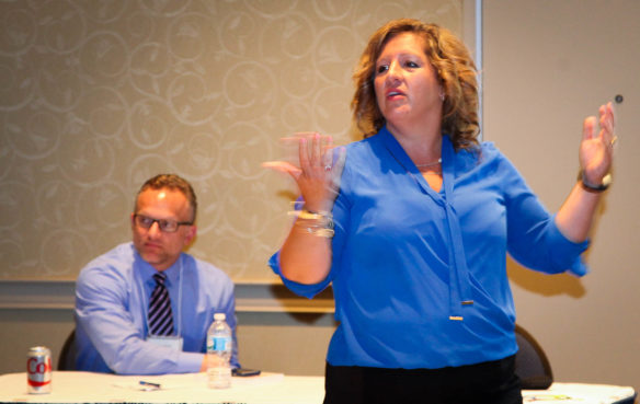 Amy Razor, executive director of the Northern Kentucky Cooperative for Educational Services, explains how the co-op created regional professional learning communities during the Continuous Improvement Summit in Lexington. Boone County Assistant Superintendent Jim Detwiler, who has helped with the PLC effort, also spoke at the session. Photo by Brenna R. Kelly, Sept. 21, 2016