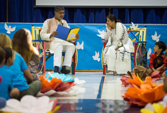 Kailash Satyarthi, left, and his wife, Sumedha sit in front of a crowd of children before speaking at Maxwell Elementary (Fayette County). Photo by Bobby Ellis, Sept. 23, 2016