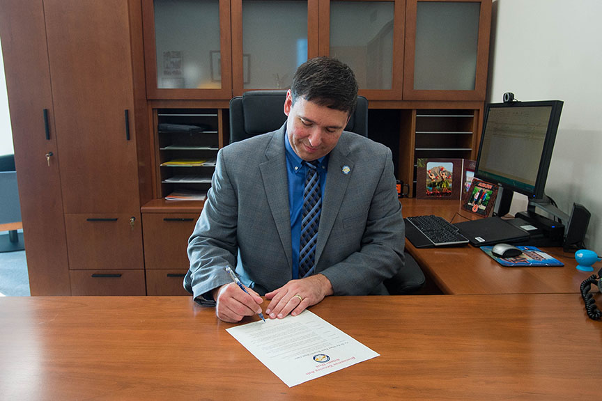 Commissioner of Education Stephen Pruitt signs a proclamation declaring Oct. 16-22 as Safe Schools Week in Kentucky. Safe Schools Week is designed to raise public awareness and improve the safety of our schools by educating students, staff and community members about bullying prevention, conflict resolution and relationship building. Photo by Bobby Ellis, Oct. 7, 2016