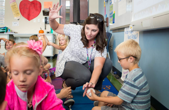Kara Northern explains shadows to a student in her first-grade class at Jody Richards Elementary. Photo by Bobby Ellis, Oct. 17, 2016