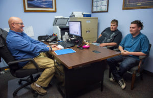 Stephen Day, human resources manager of bedding manufacturer Leggett & Platt's Winchester facility, interviews Clark County Area Technology Center seniors Brett Foley, center, and Garrett Samuels as part of a partnership between the factory and the school in which students will work at the factory for a few hours a week. Photo by Bobby Ellis, Oct. 25, 2016