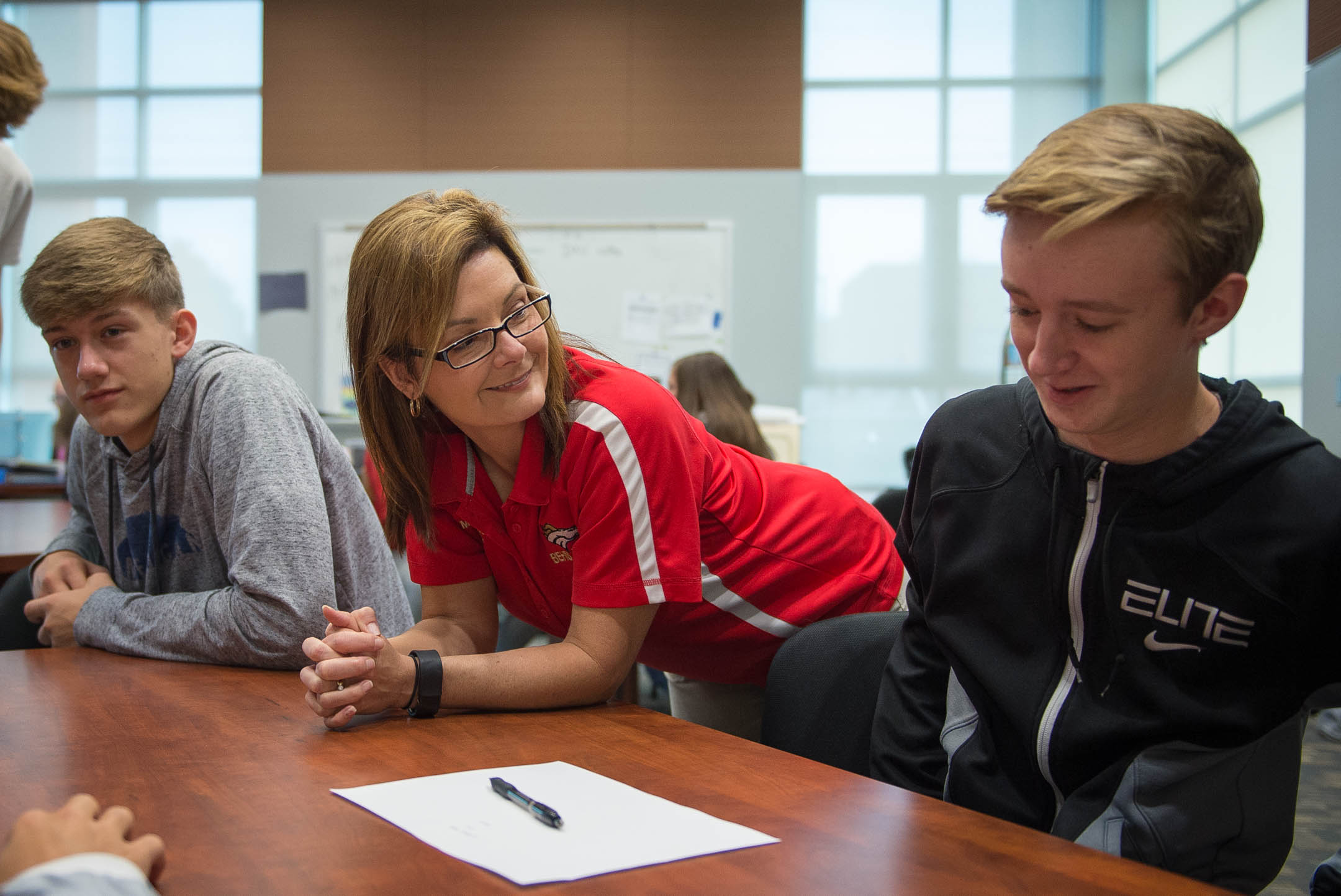 Jake Keys, right, a sophomore at Bullitt East High School (Bullitt County), discusses a business plan with business teacher Amanda Comstock. Photo by Bobby Ellis; Nov. 1, 2016