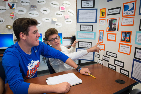 Luke Fisher, left, and Mason Epperson, junior at Eastern High School (Jefferson County) examine a display they plan to model a class project off of in Jody Charleston's business class. Photo by Bobby Ellis; Nov. 1, 2016