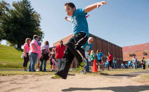 Eric Holden, a fourth-grader at Kentucky School for the Blind, competes in the long-jump. Photo by Bobby Ellis; Oct. 12, 2016
