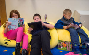 Nakalynn Hensley, Nathaniel Fiorenza and Ethan Callahan, left to right, 2nd-grade students at Johnson Elementary School (Laurel County), read during class. Johnson Elementary, which was named a 2016 National Blue Ribbon School, have climbed to 88 percent during the past three years thanks to a school- and districtwide emphasis on reading. Photo by Bobby Ellis, Nov. 18, 2016
