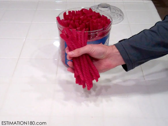A sample question from www.estimation180.com. Students are asked to estimate how many pieces of licorice the teacher is holding. As a follow-up question the next day, students are asked to estimate how many pieces of licorice are in the entire container. Submitted photo courtesy of www.estimation180.com