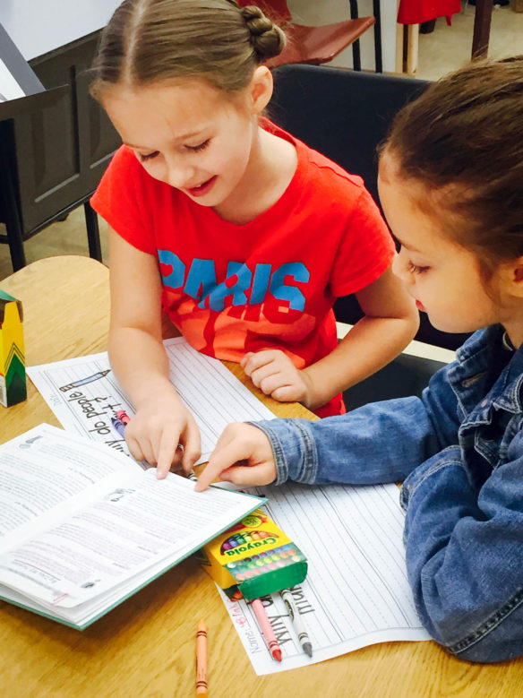 Cold Hill Elementary School (Laurel County) students, from left, Lillian Harper and Blakely Beth Callahan work on lessons that are part of the Creative Spanish learning program created by local teacher Melanie Callahan. The lessons encourage students to express themselves through visual and performing arts. Submitted photo by Melanie Callahan