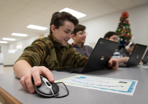 Hayden Henry makes a game during the Hour of Code. Photo by Bobby Ellis, Dec. 7, 2016