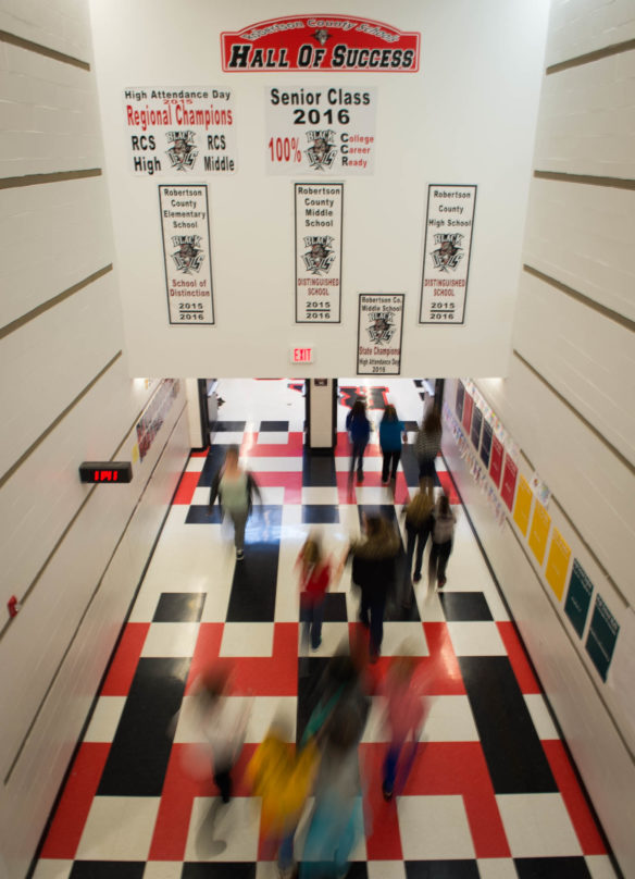 Robertson County School students walk through the "Hall of Success" in between classes. The school has made it a habit to celebrate its students' success, including having 100 percent of seniors college and or career ready in 2016. Photo by Bobby Ellis, Dec. 13, 2016