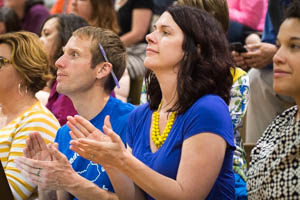 Ashley Lamb-Sinclair, the 2016 Kentucky Teacher of the Year, applauds a speaker during Department of Education Town Hall event at Seneca High School (Jefferson County). Lamb-Sinclair said the Teacher Achievement Awards program gives educators the chance to speak for their profession. Photo by Bobby Ellis, April 21, 2016